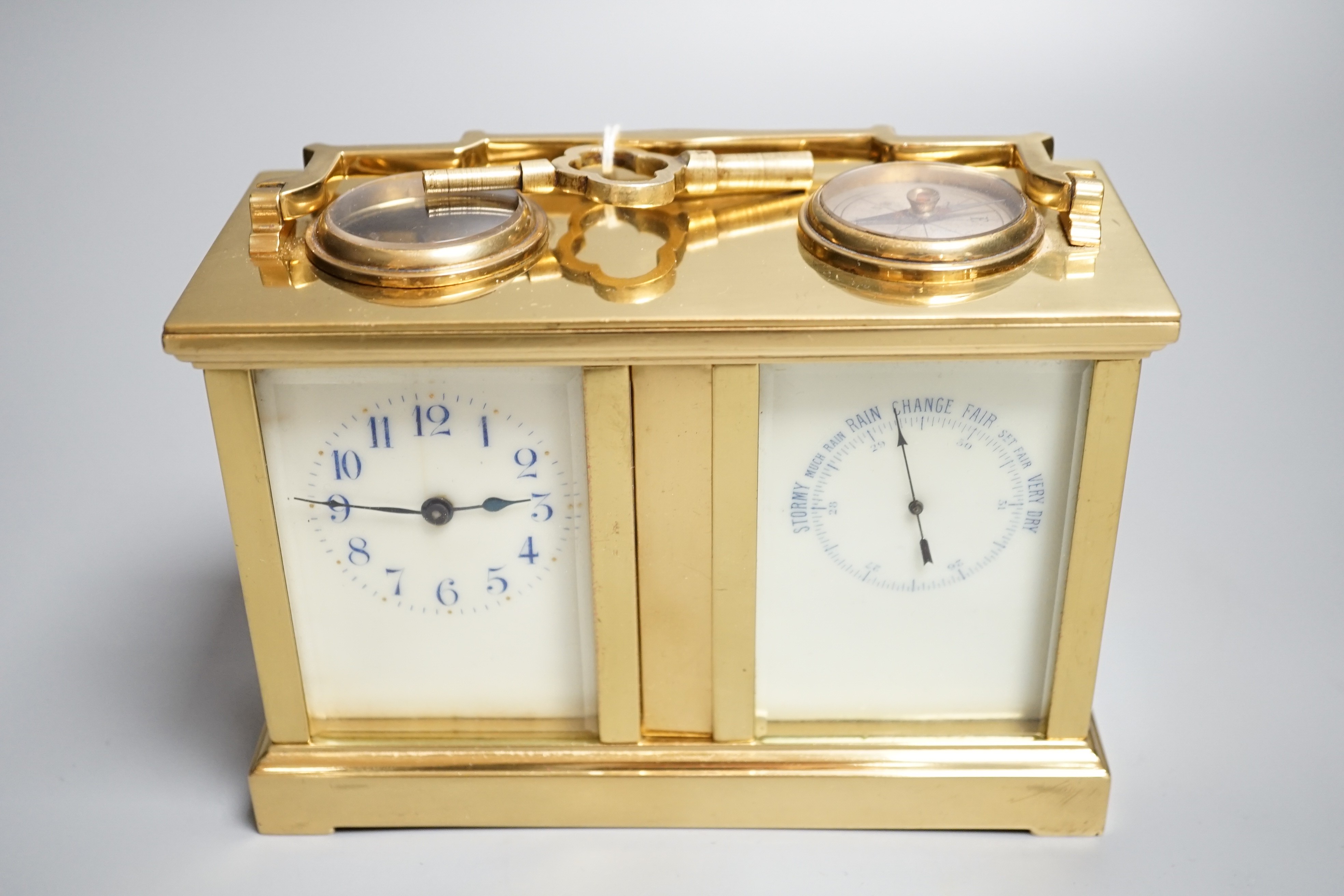 A late 19th century French brass cased eight day timepiece, combined barometer/compass, heighg 11cm